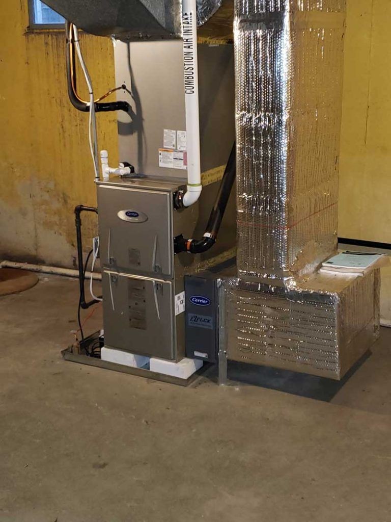 Technician installing a high-efficiency furnace for improved home heating, and Expert performing maintenance on a residential boiler for efficient heating